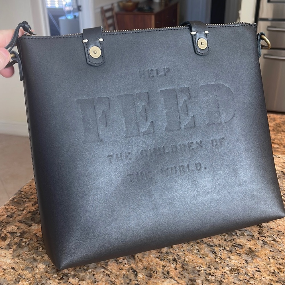 Feed leather crossbody 50. NWOT.